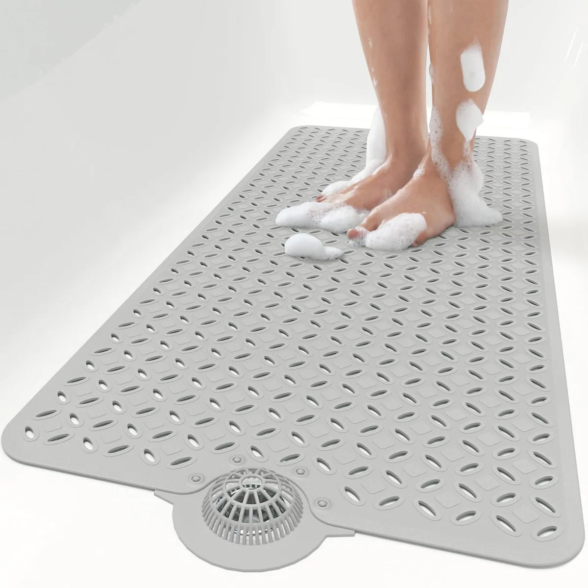 Grey rectangular bath mat 39 by 17 inches with detachable hair catcher and 604 oval drain holes