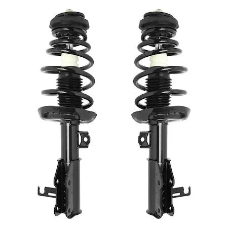 Two silver strut assemblies with black coil springs and upper mounts on grey surface