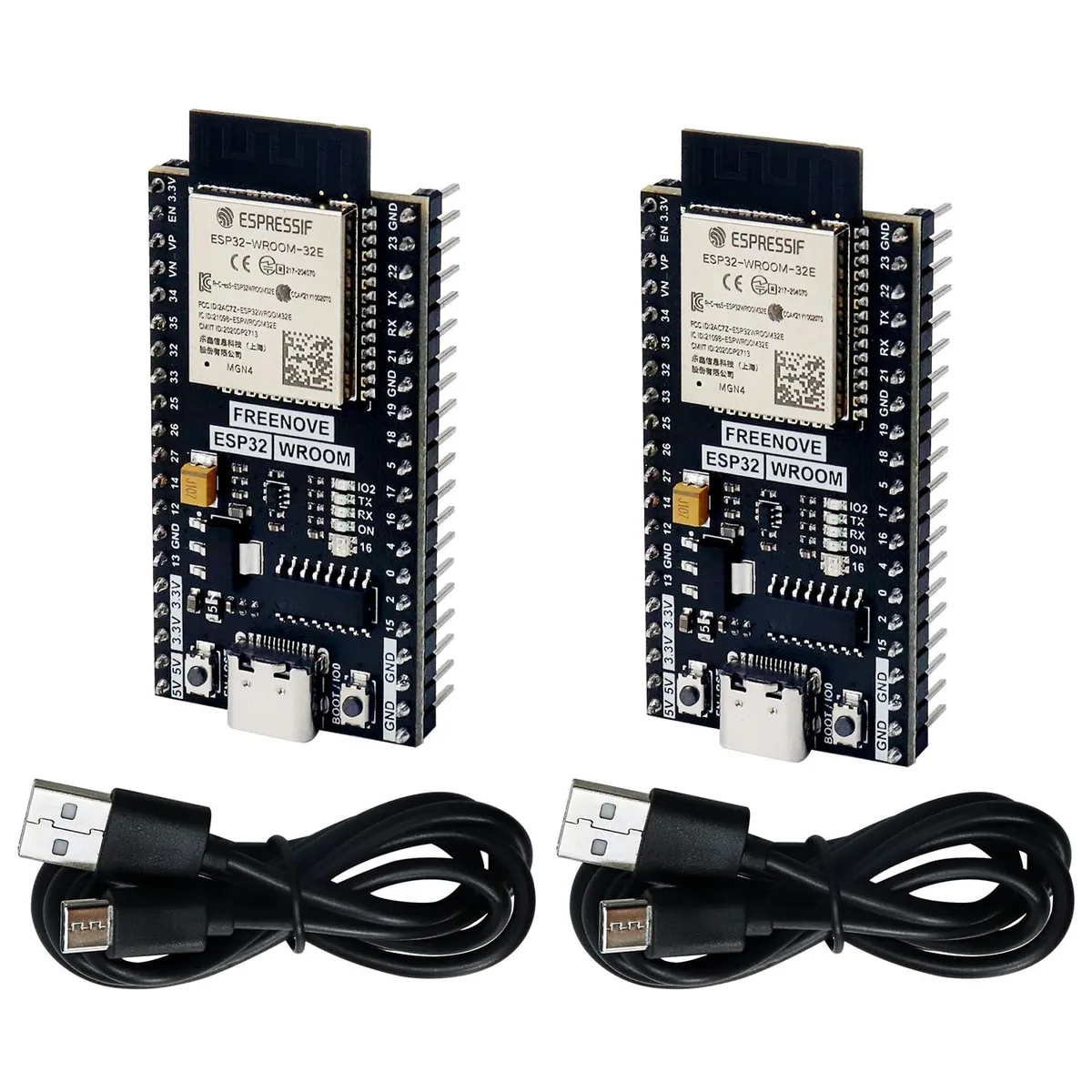Two small green ESP32 development boards with pin headers side by side