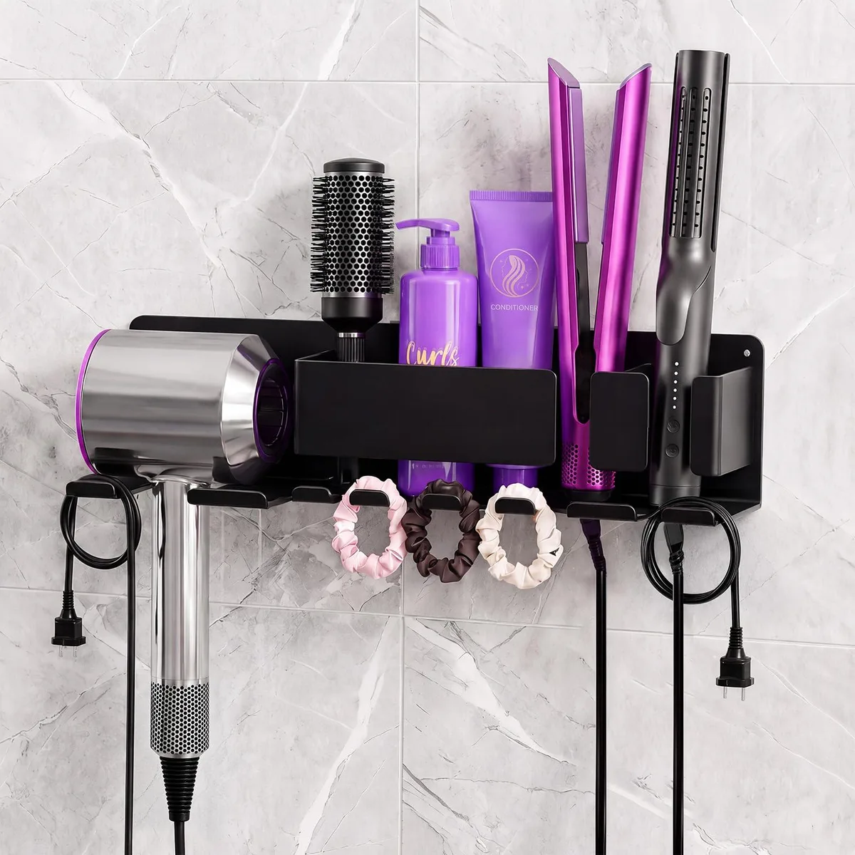 Black metal wall-mounted hair tool organizer with hooks and compartment