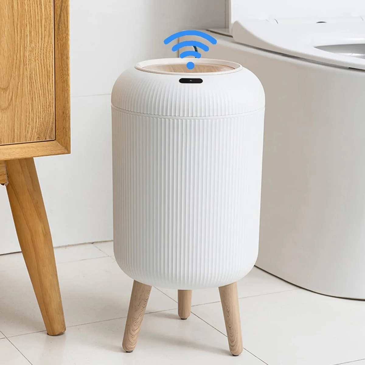 Black rectangular bathroom bin with wave-patterned lid and motion sensor, 14.33in wide