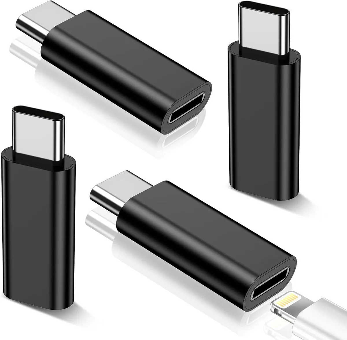 Four small USB-C to Lightning adapters with silver metal casings