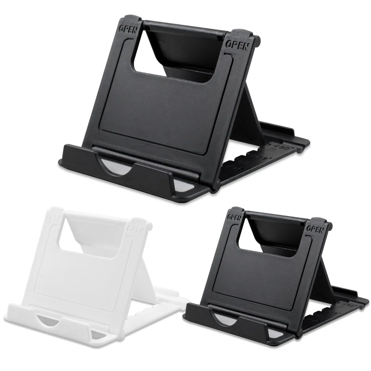 Three foldable phone stands, two black and one white, lying flat on a surface