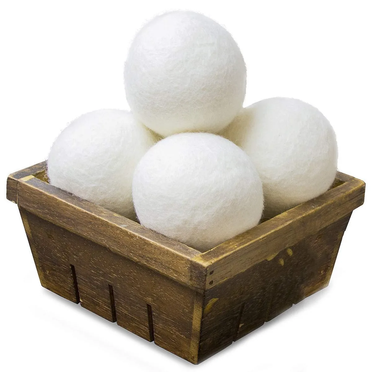 Four white wool dryer balls in a pack