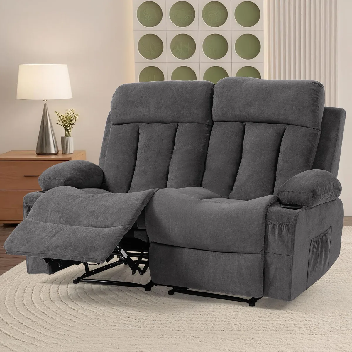 Grey fabric loveseat with two manual reclining seats, cup holders and storage pockets