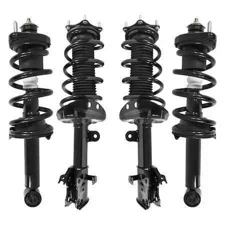 Four silver strut assemblies with black coil springs and mounting hardware
