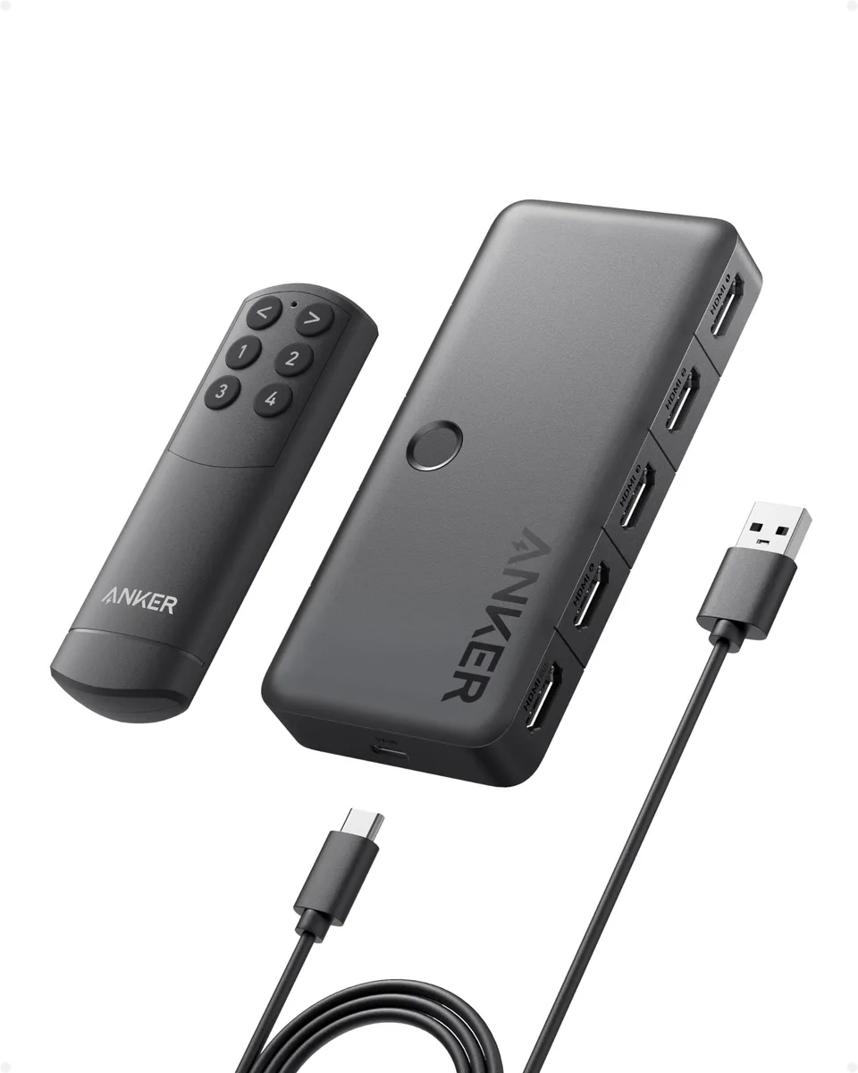 Compact black HDMI switch box with four input ports and remote control