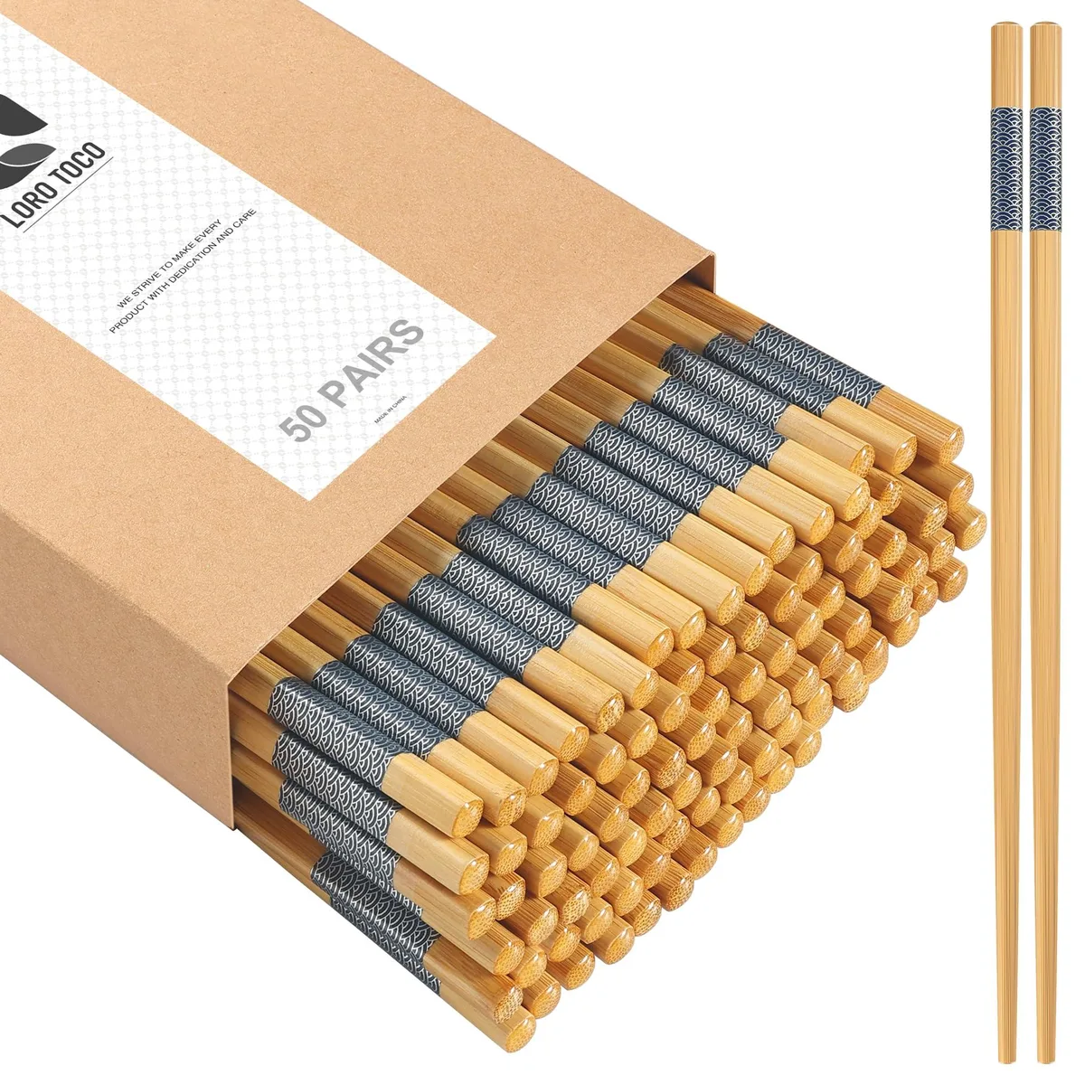 Seven black bamboo chopsticks with stainless steel tips and rounded handles lying flat
