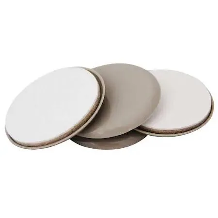 Four beige round self-stick felt sliders with plastic base