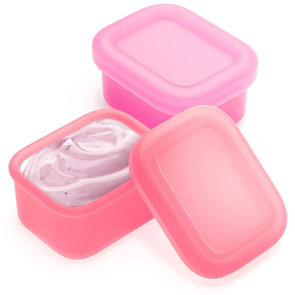 Two small fuchsia and pink silicone sauce cups with lids