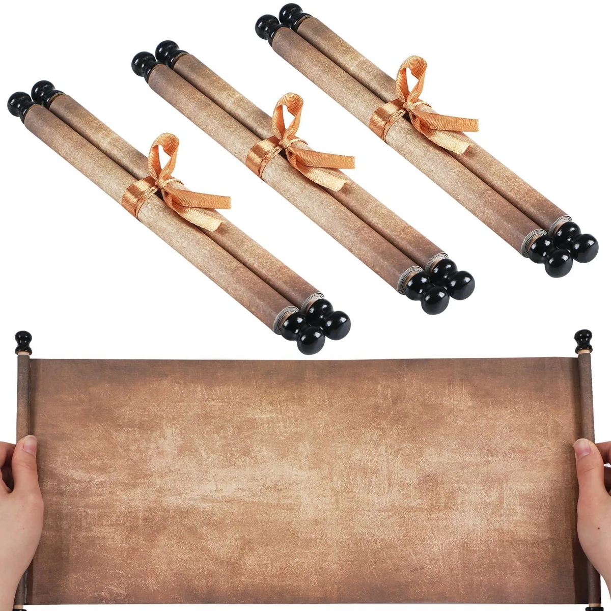 Three rolled vintage paper scrolls on wooden rods