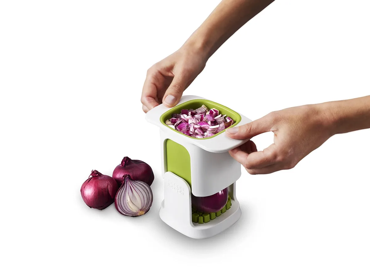 White square vegetable chopper with stainless steel blades and collection container