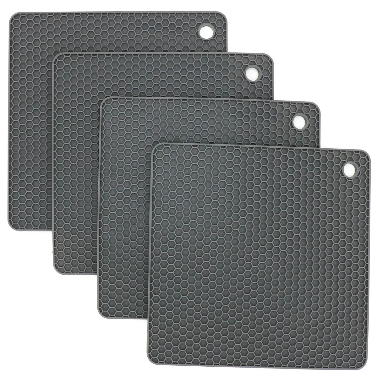 Four dark grey square silicone trivets with textured surface