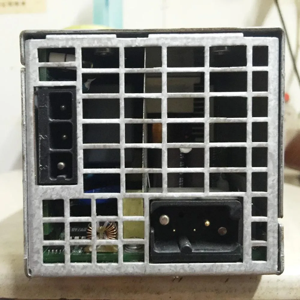 Rectangular black ATX power supply unit with ventilation grille and label showing 48V 2000W
