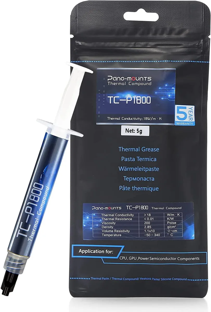 Small white tube of thermal paste with applicator tools