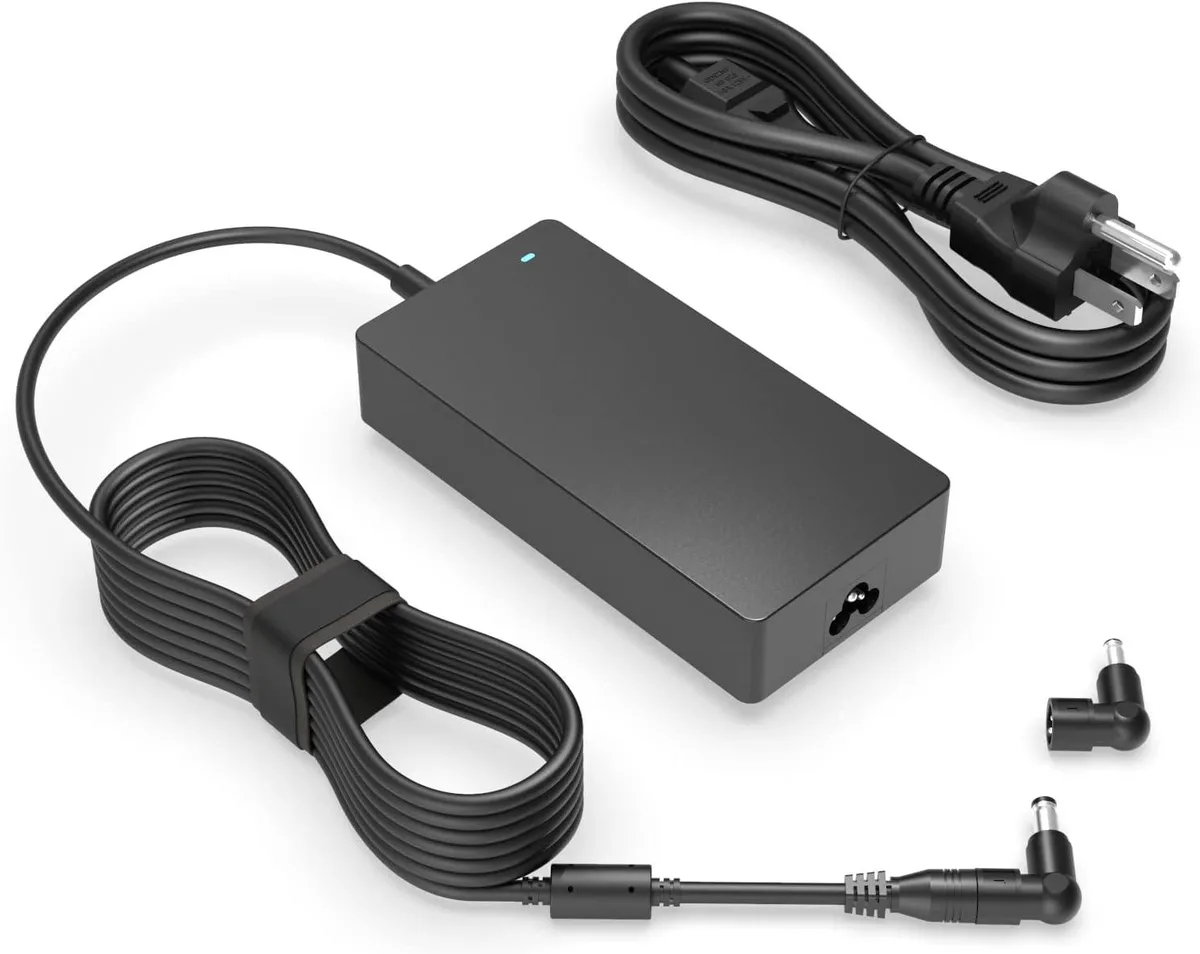 Rectangular black power brick with detachable mains cable and two round connectors