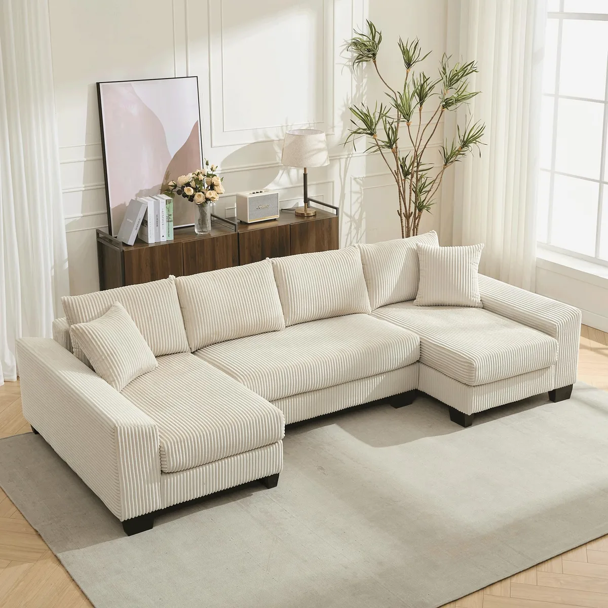Large beige corduroy U-shaped sectional sofa with chaise and pull-out bed function