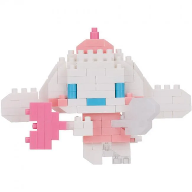Small white angel figure built from tiny bricks, sitting pose with wings and halo