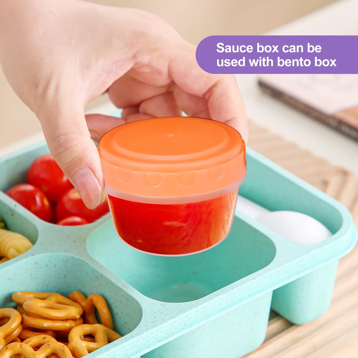 Twelve small square multi-colour food containers with lids