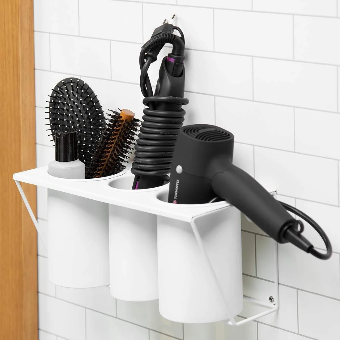 White steel wall-mounted hair dryer holder with three detachable compartments and drain holes