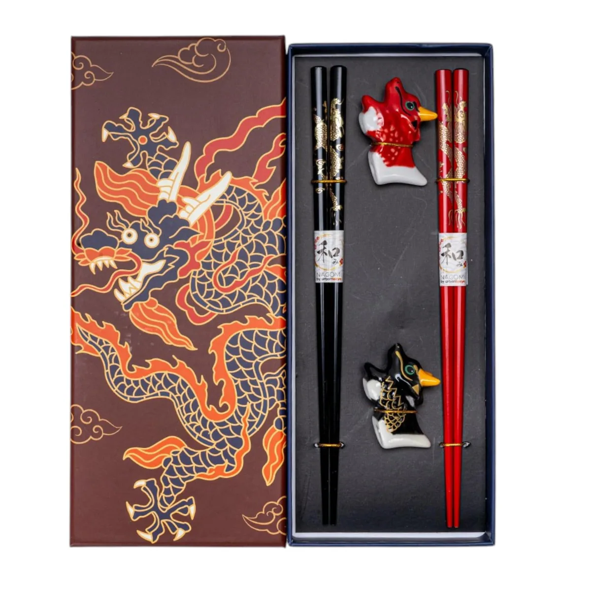 Two pairs of black bamboo chopsticks with ceramic cat rests in a gift box