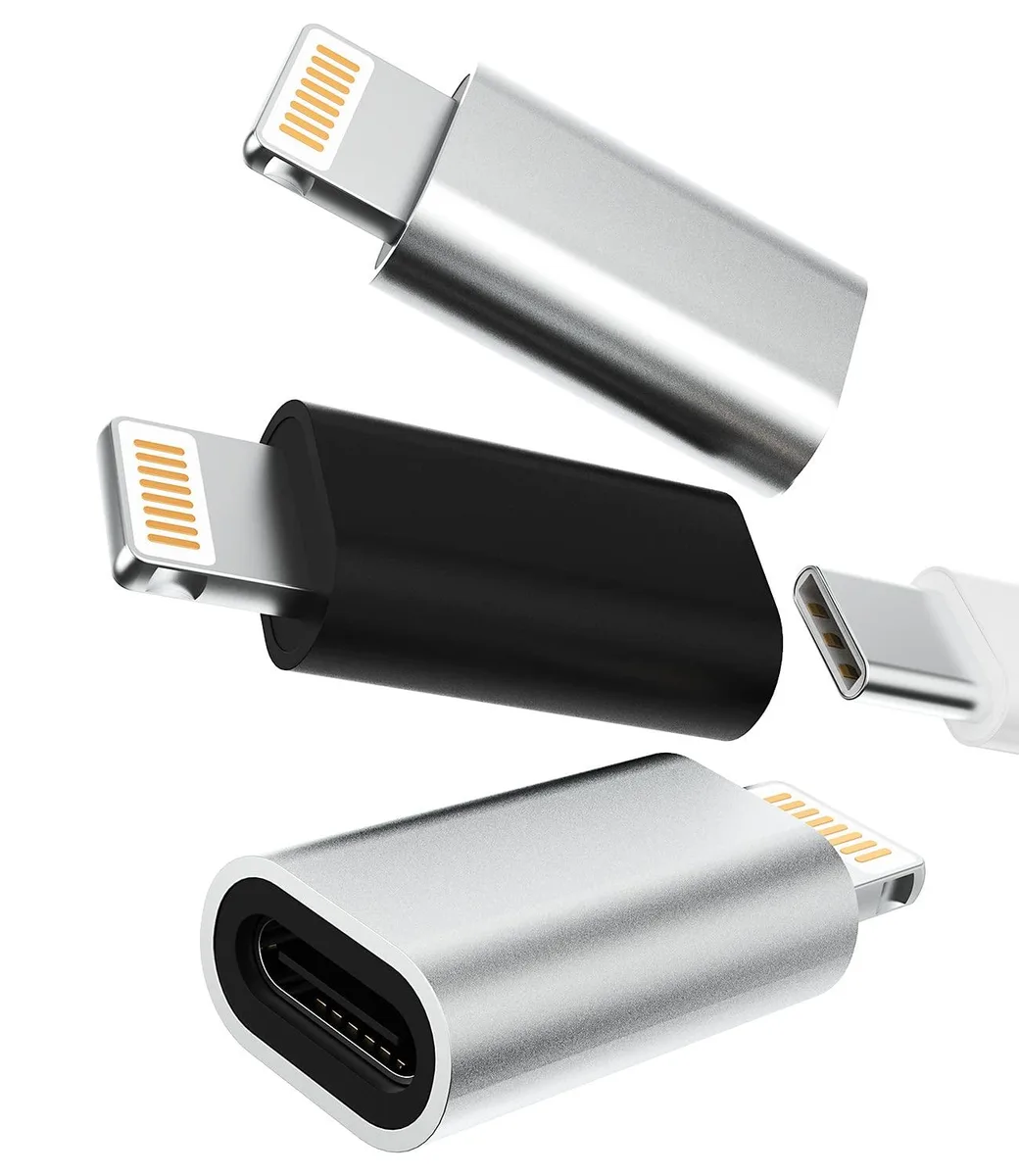 Three tiny silver dongles with white lanyards attached