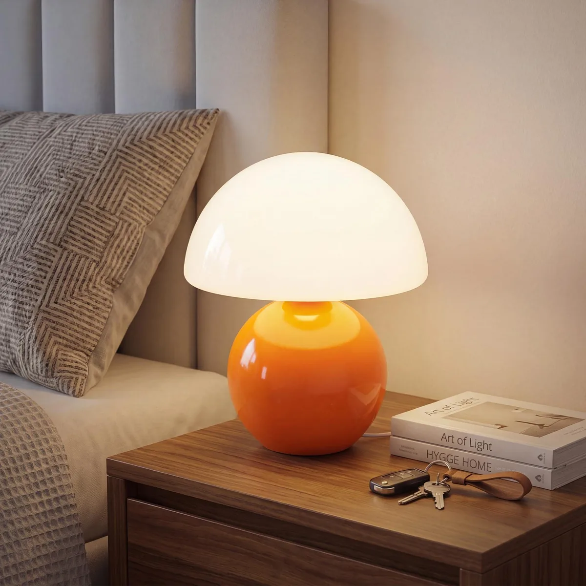Orange glass mushroom table lamp on stained ceramic base