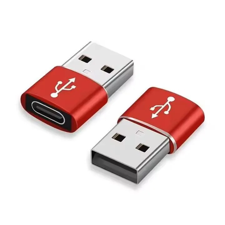 Three small black USB-A to USB-C adapters, rectangular with rounded edges, matte finish