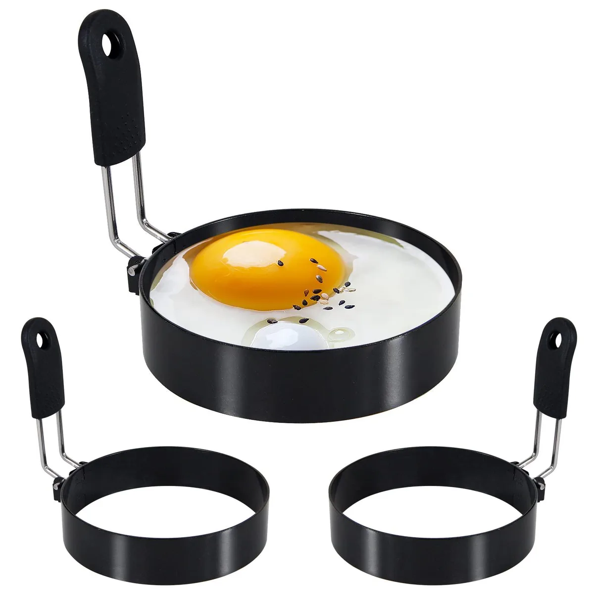 Three stainless steel egg rings with silicone handles