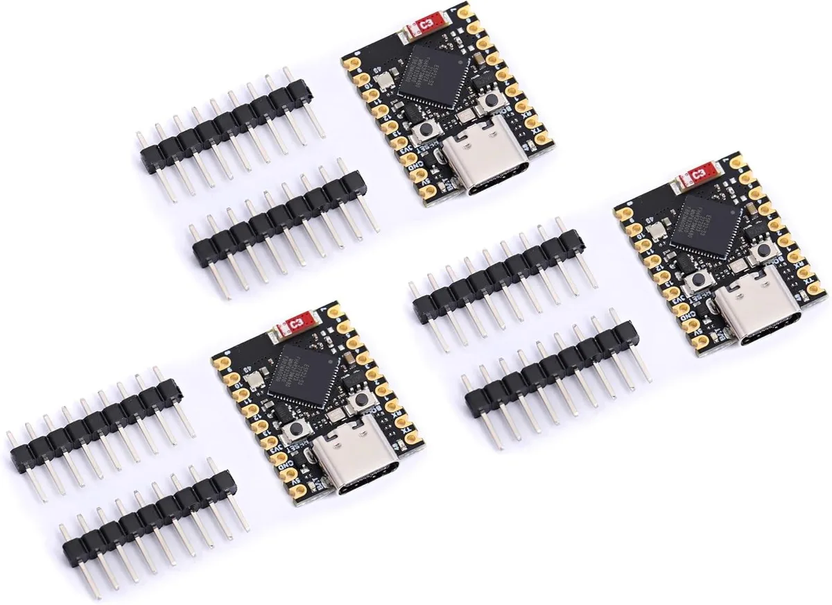 Tiny green circuit board with pin headers, thumb-sized form factor