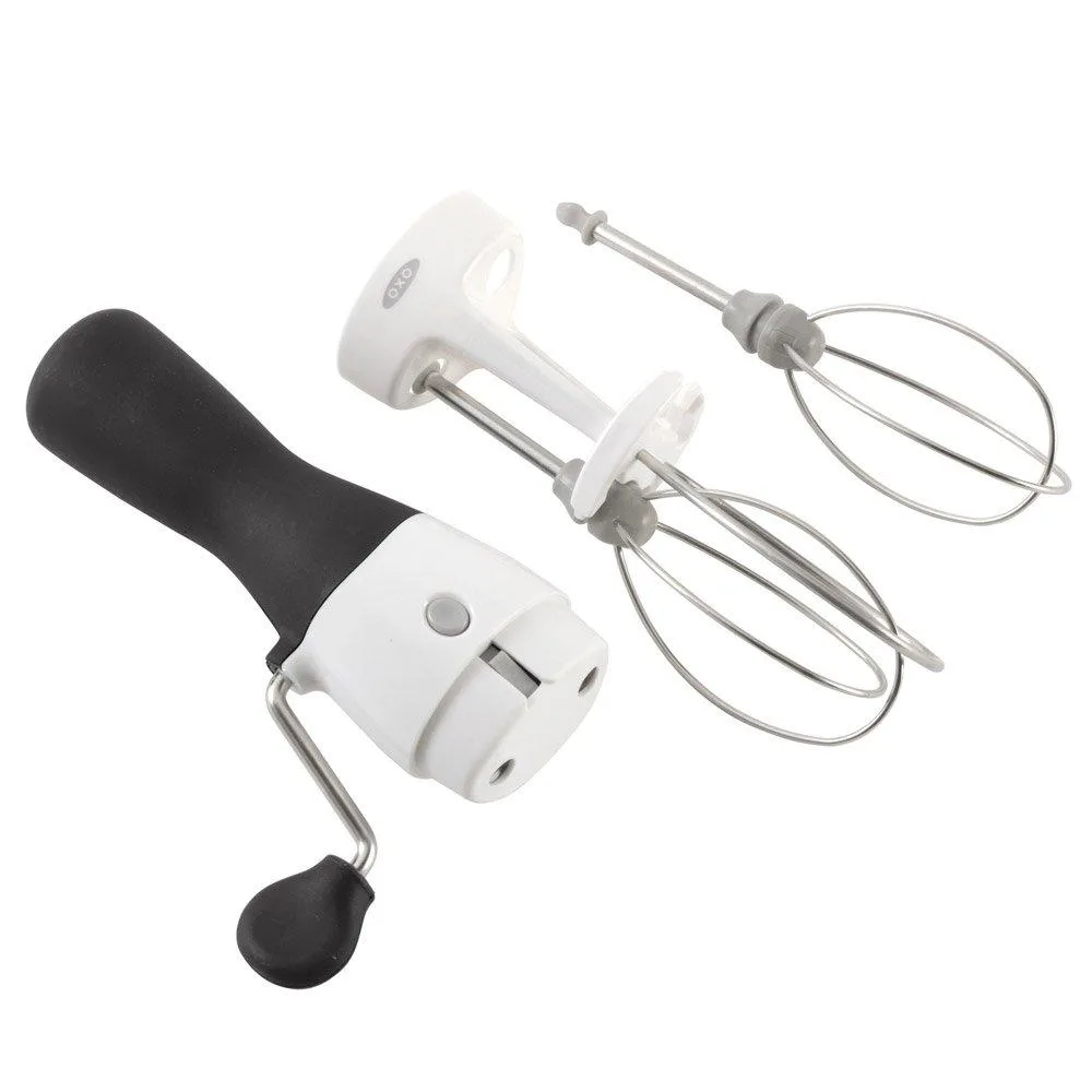 White and black hand-crank egg beater with soft non-slip handle and stainless steel beaters