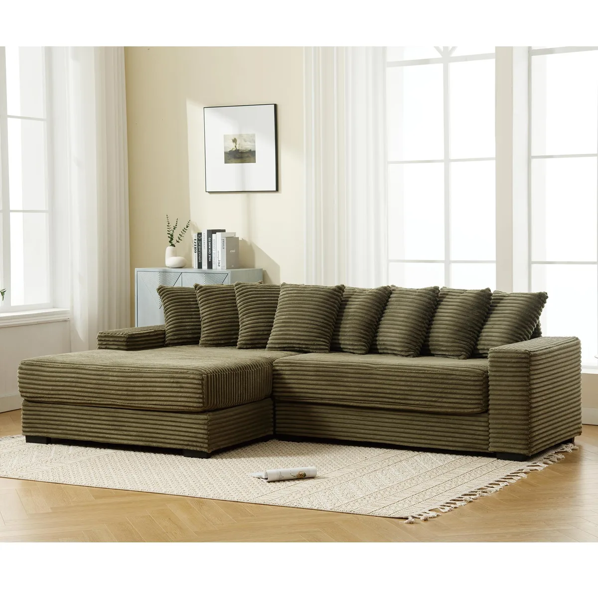 Green L-shaped corduroy sectional with left chaise and eight matching pillows