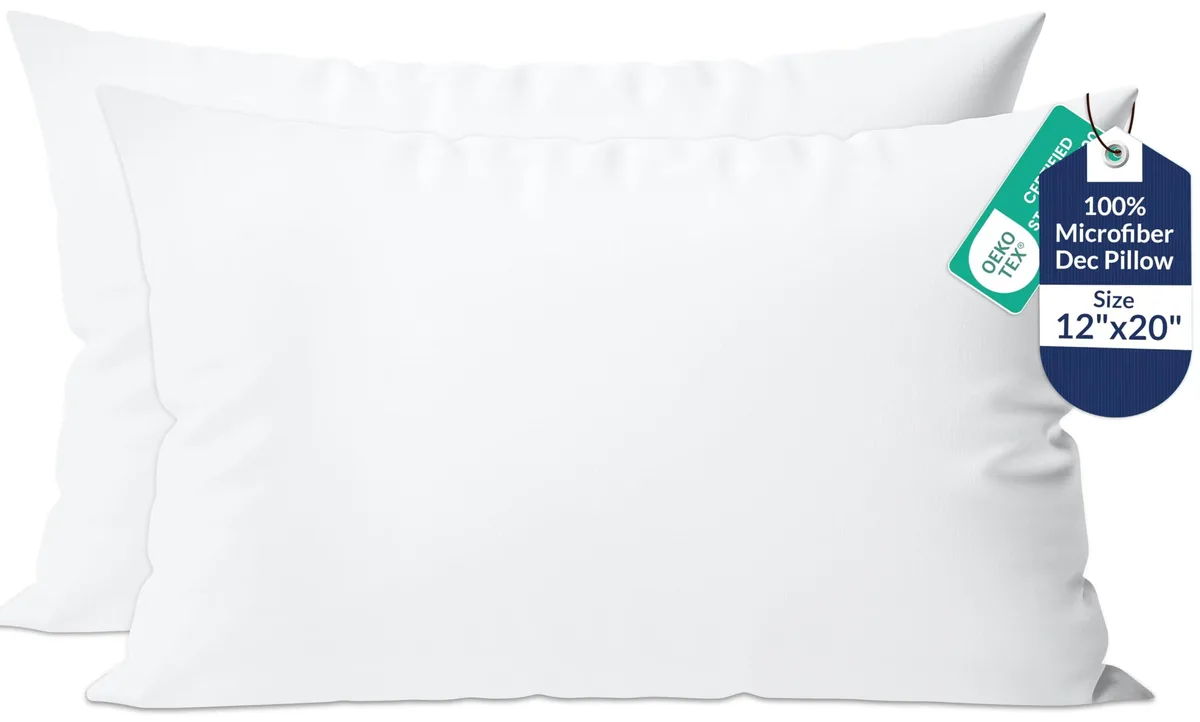 Two white rectangular pillow inserts side by side