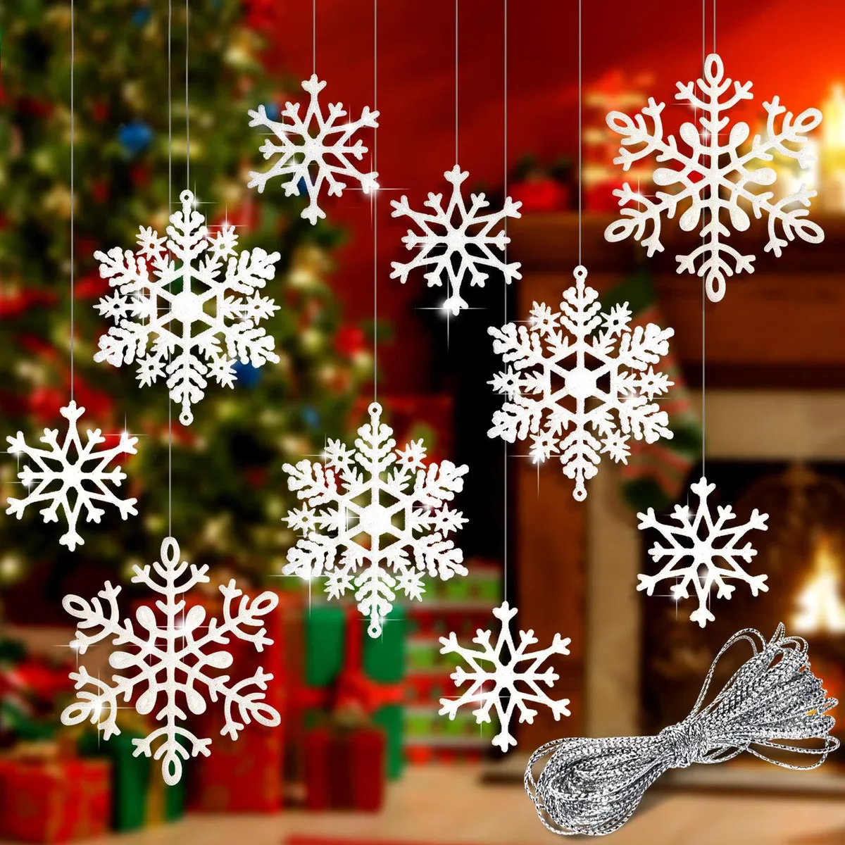 Forty blue PVC snowflakes with white glitter on silver rope