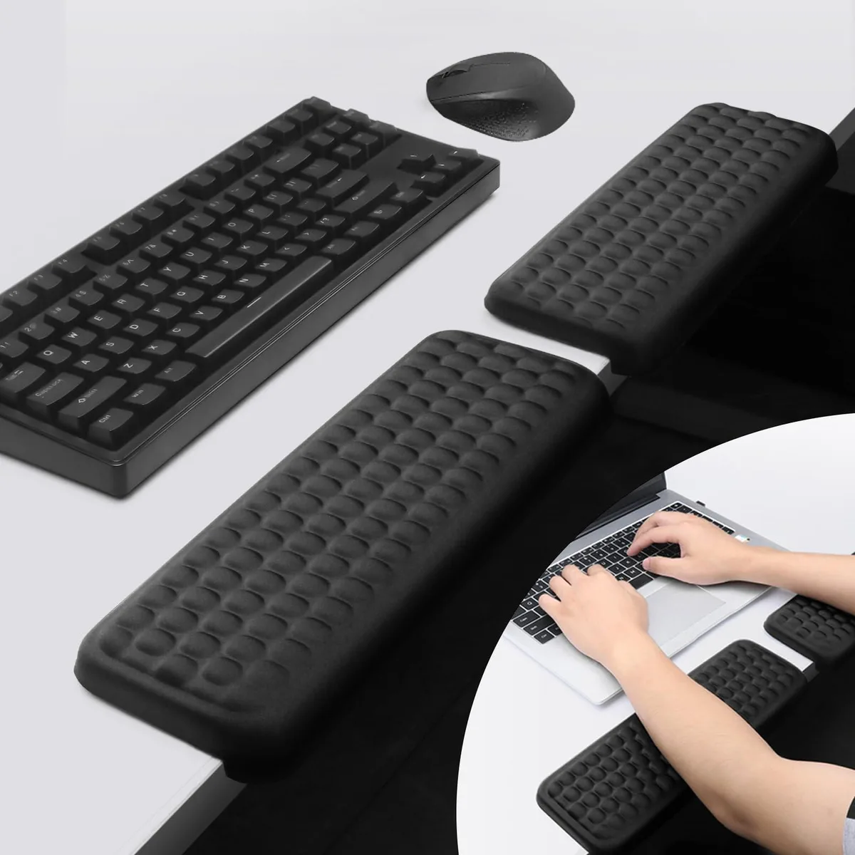 Pair of black L-shaped memory foam elbow pads with non-slip bases on a desk
