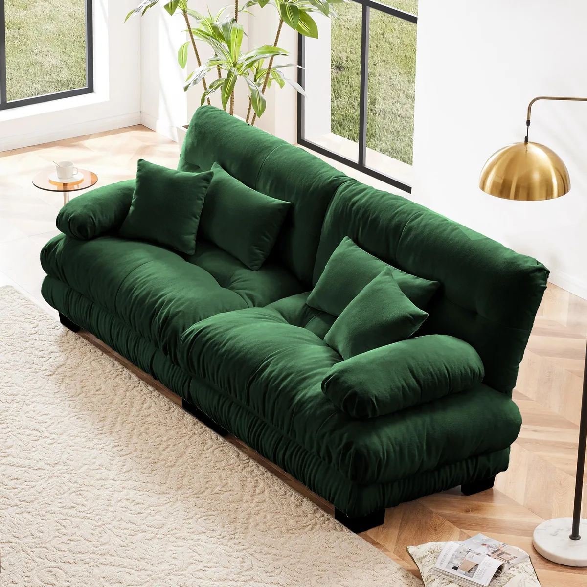 Green chenille two-seater sofa with rounded bolster arms and four pillows