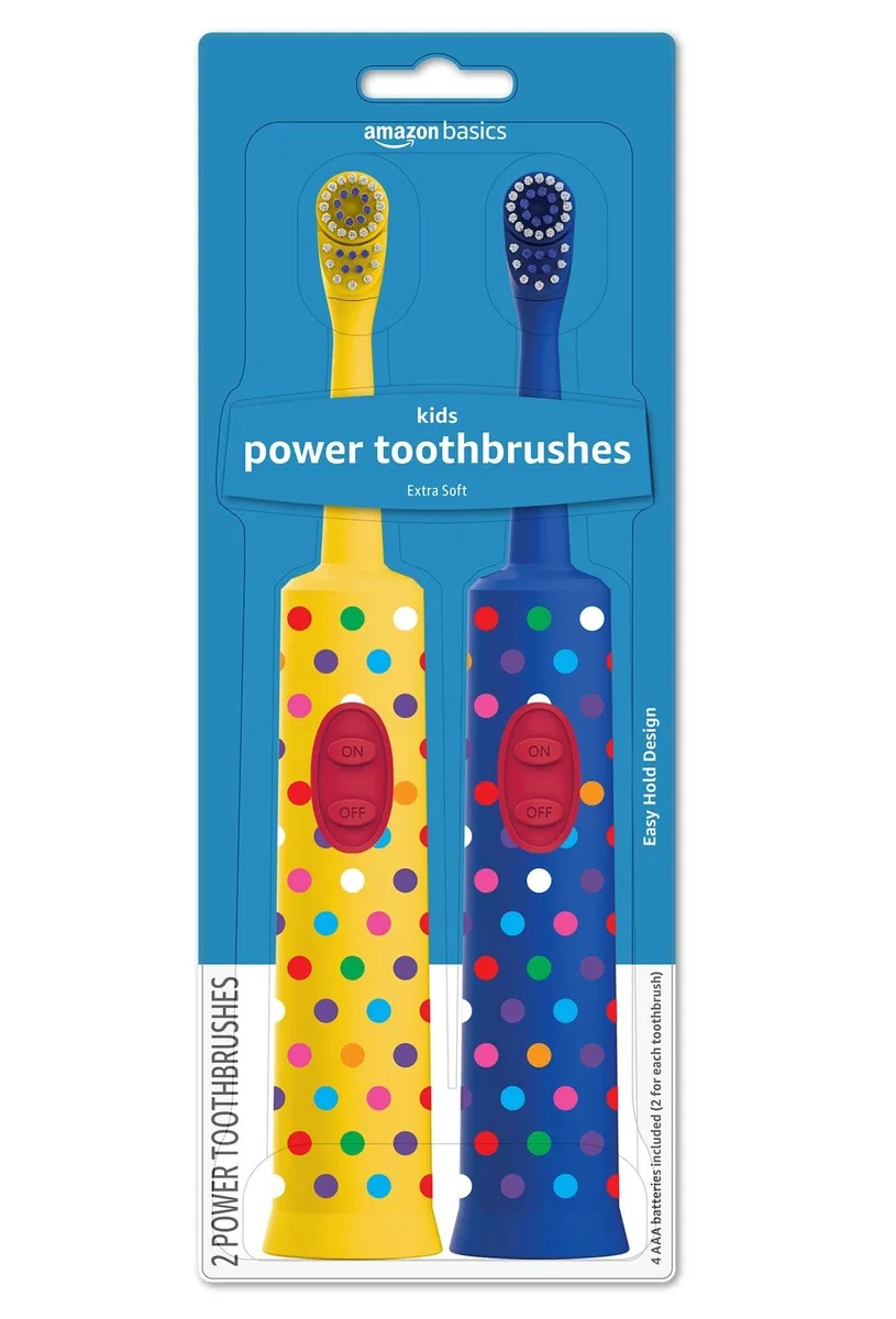 Two white battery-powered kids electric toothbrushes with oscillating heads