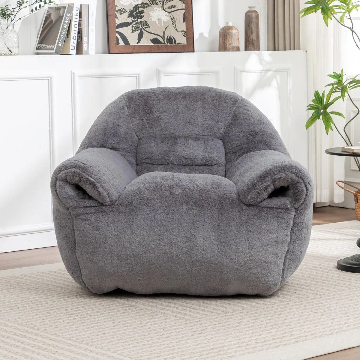 Dark grey faux-fur bean bag sofa with back support, round floor cushion shape