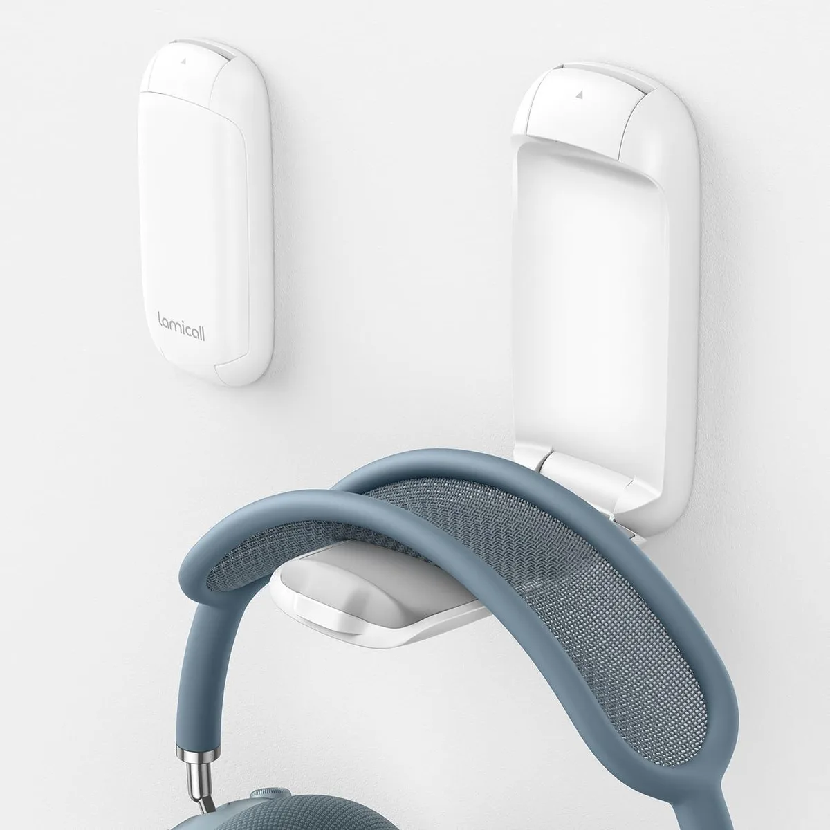 White foldable headphone clamp with silicone pads and adhesive base