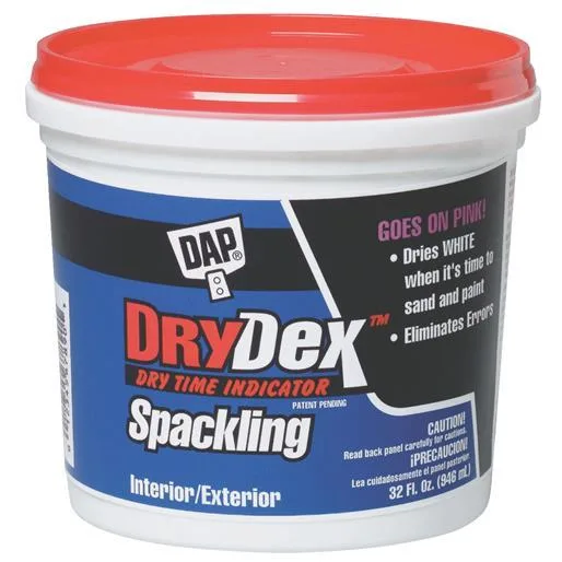 White paste spackling in a 32 oz pail with applicator