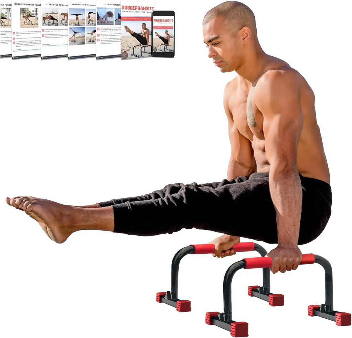 Pair of steel parallettes with foam grips and rubber feet on floor
