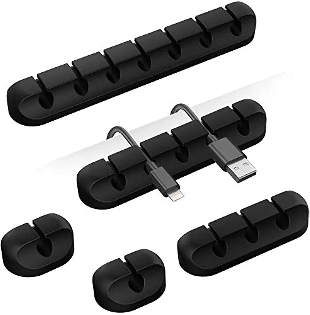 Five black silicone cord clips with varied slot counts, self-adhesive backing visible