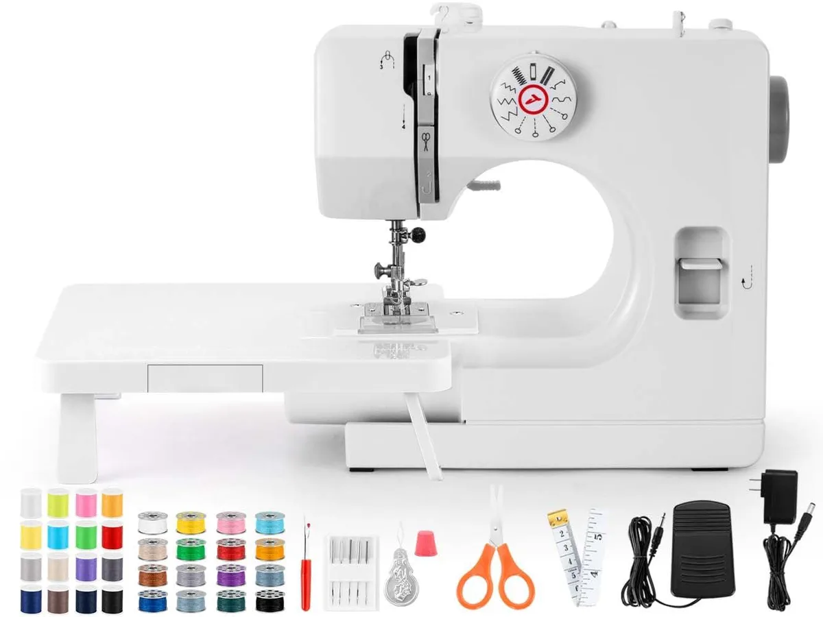 Gray compact sewing machine model 725 with extension table and 16 thread spools