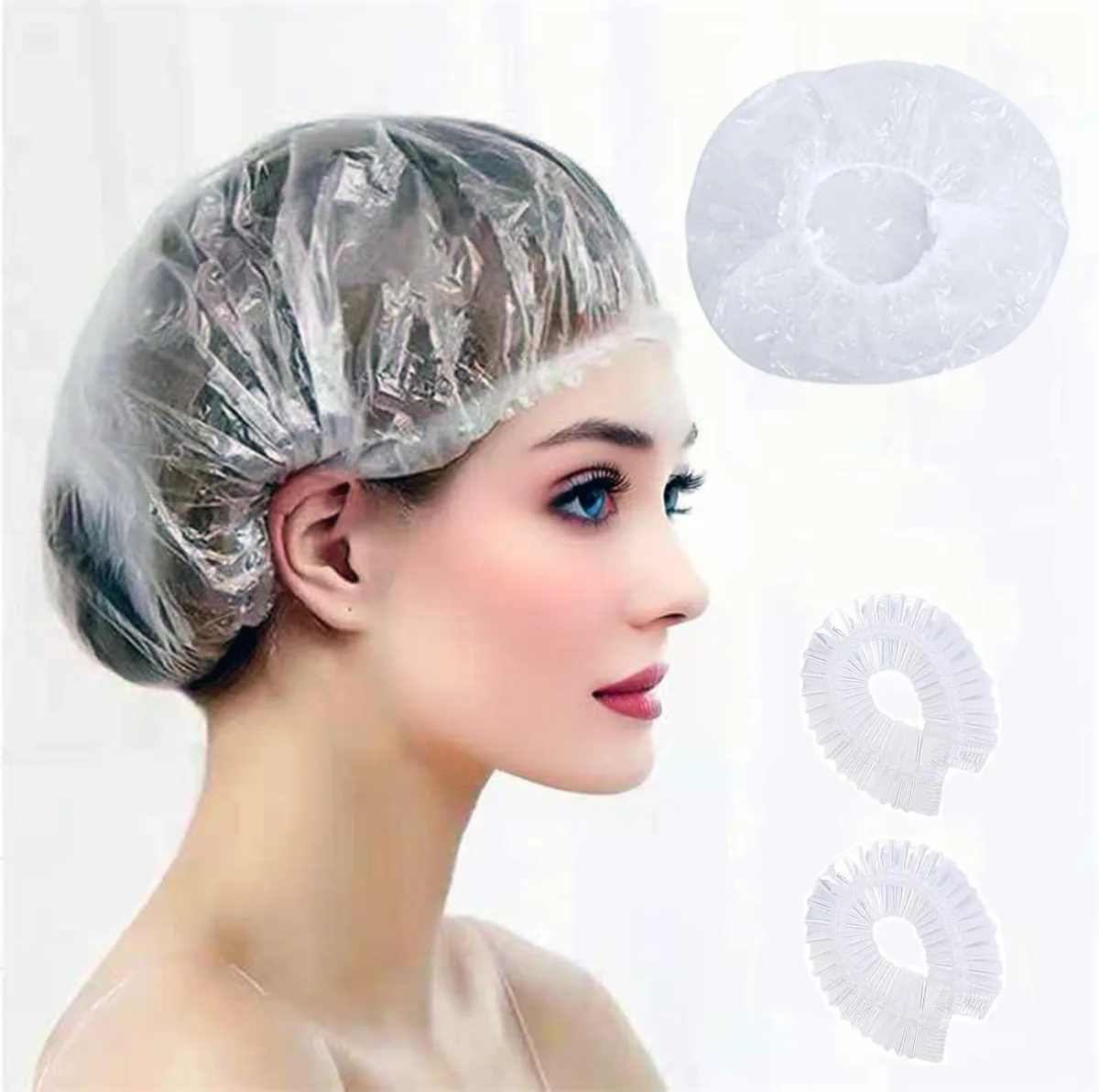 Clear polyethylene shower caps in a bulk pack of one hundred, each stretching to twenty point five inches diameter