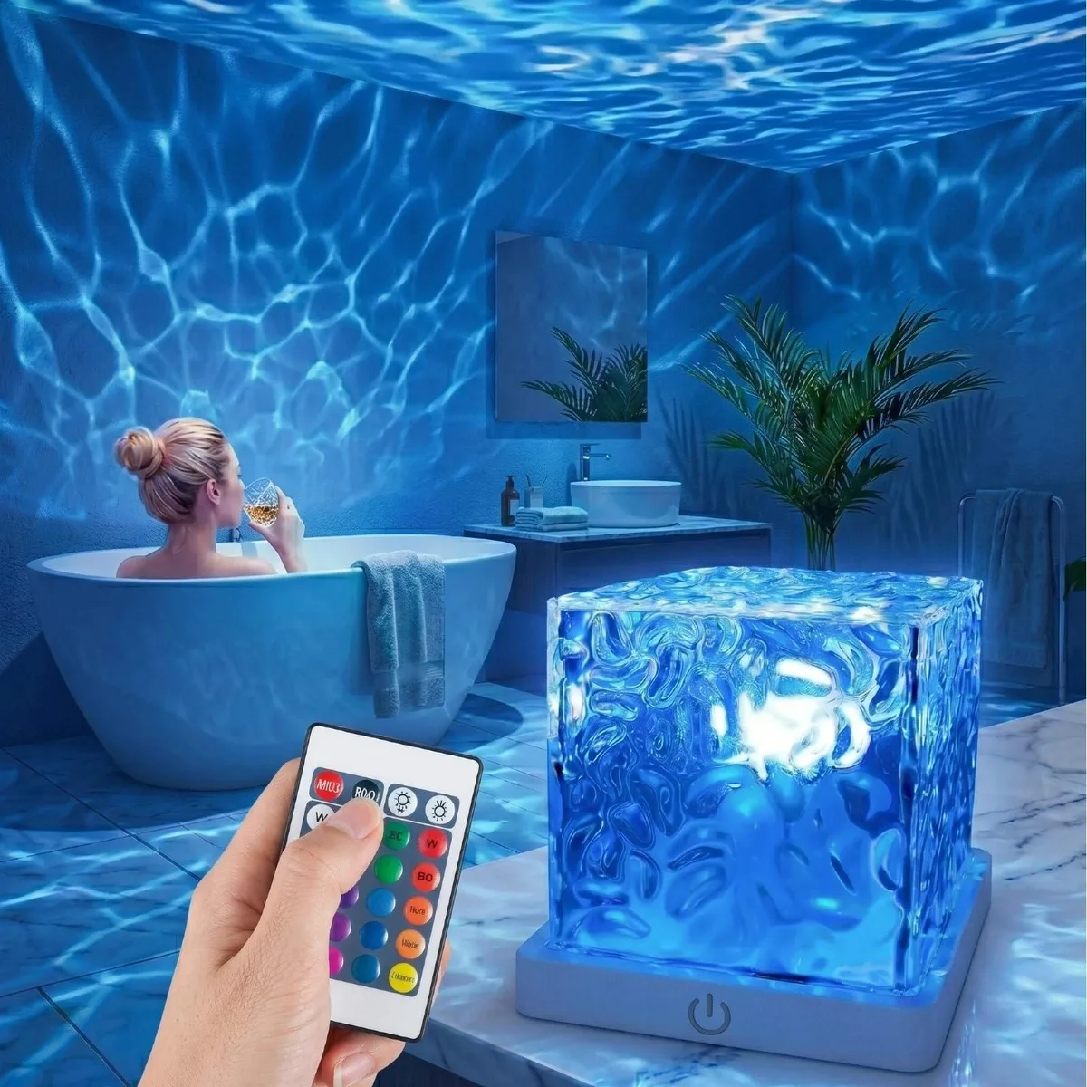 Cube-shaped rechargeable projector with polished chrome finish, projects ocean waves
