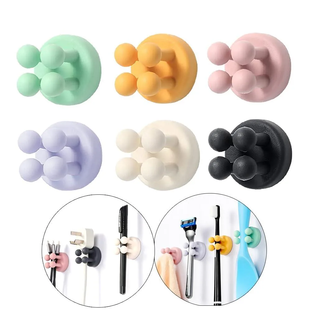 Six small square silicone hooks in pastel colours with adhesive backs