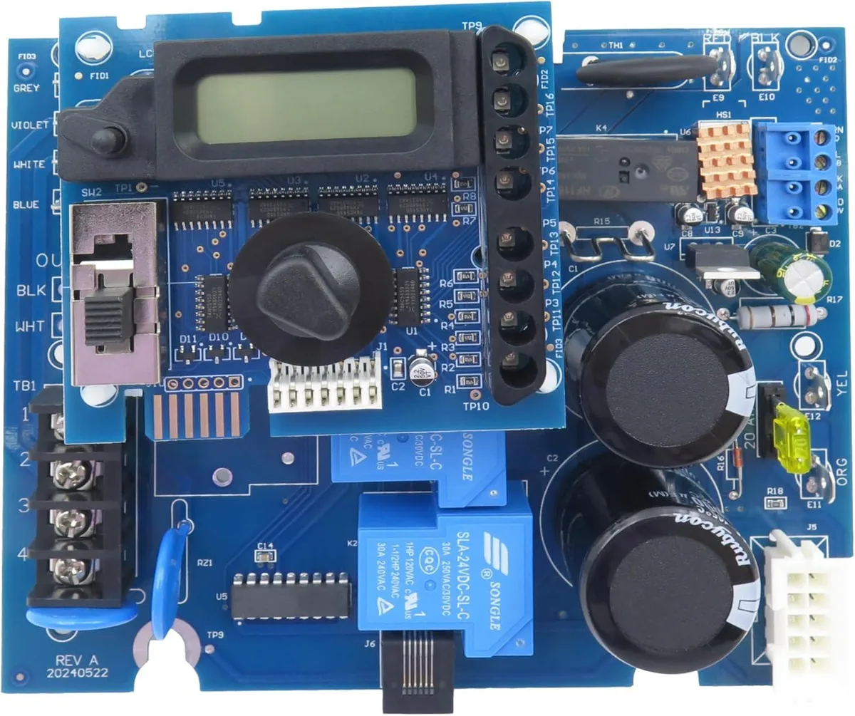 Two green circuit boards, one larger main board and one smaller display board, with integrated chips and a 24-pin power connector