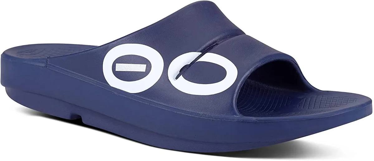 Navy synthetic slide sandal with contoured footbed, textured strap and foam midsole