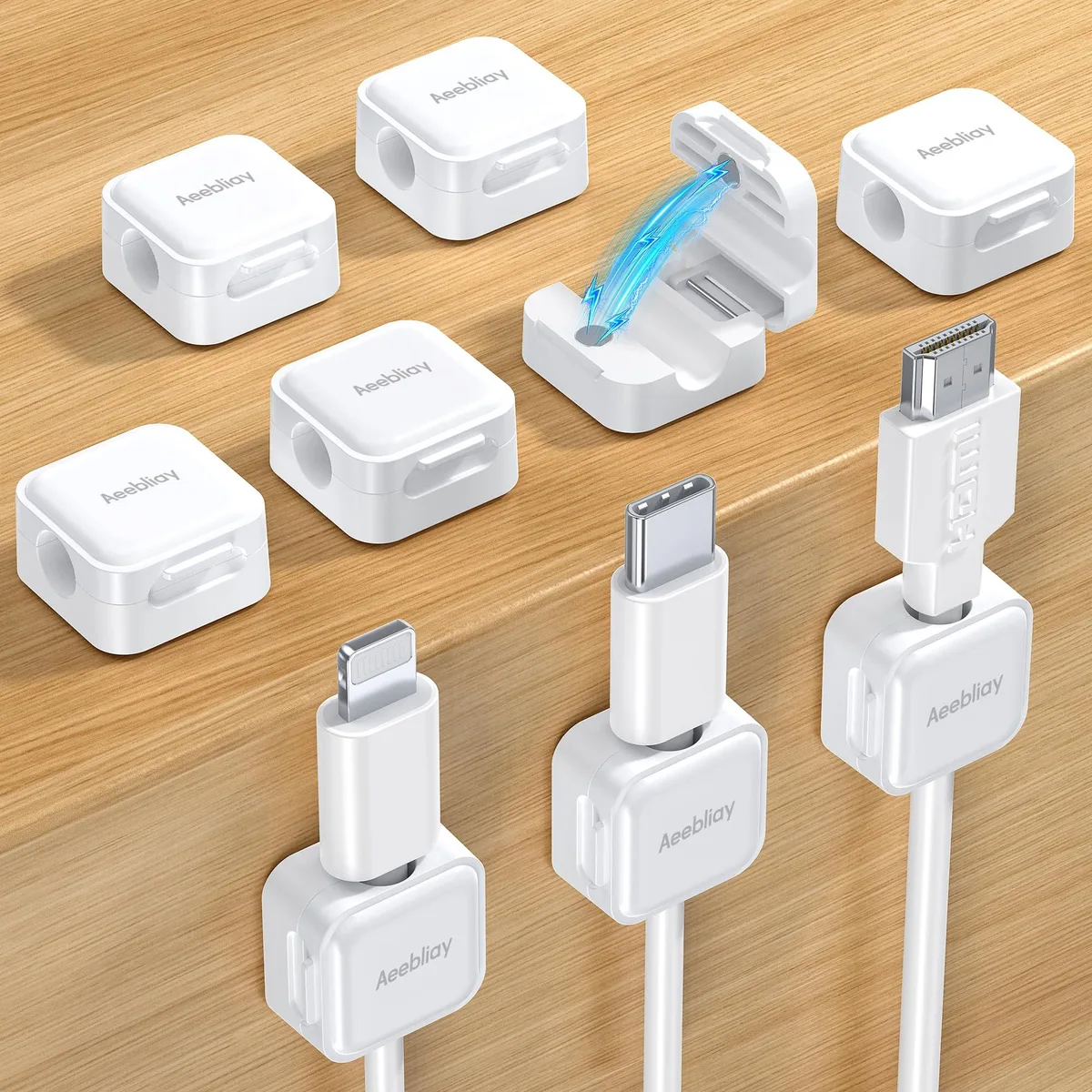 Nine small white square acrylic clips with magnetic centres on a backing sheet