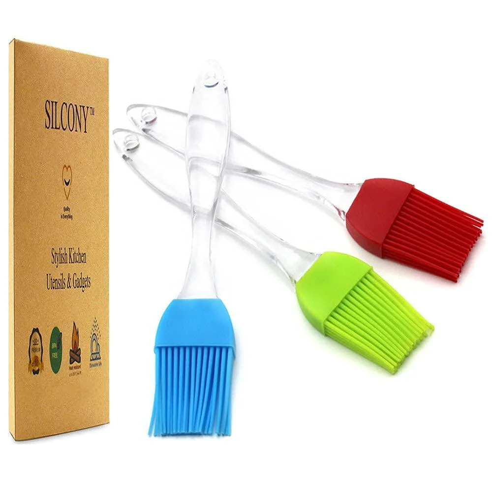 Three silicone basting brushes in blue, green and red, each about seven inches long with flexible bristles and a detachable head